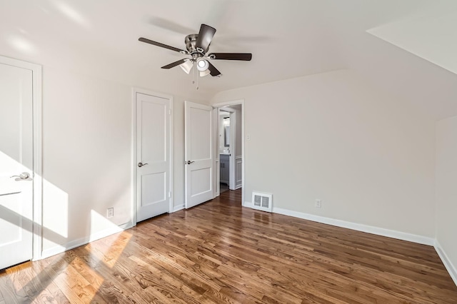 unfurnished bedroom with a ceiling fan, wood finished floors, visible vents, and baseboards