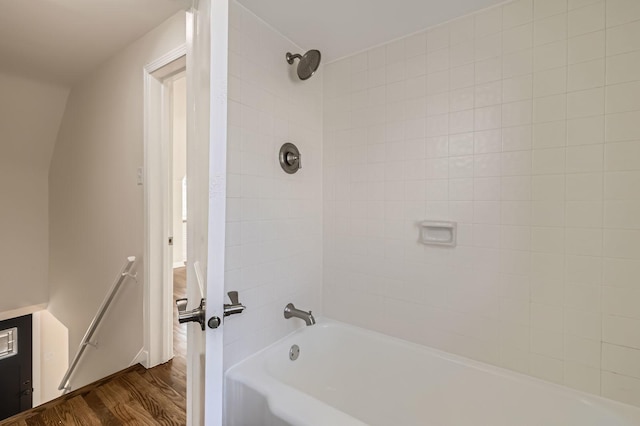 full bath with shower / bath combination and wood finished floors