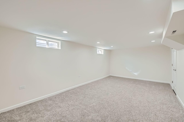 below grade area featuring recessed lighting, baseboards, and carpet floors