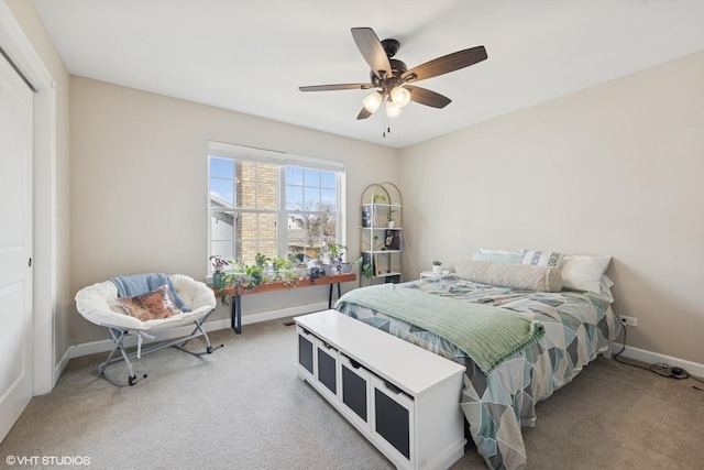 bedroom with ceiling fan, baseboards, a closet, and light carpet