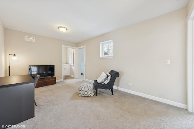 sitting room featuring visible vents, baseboards, and carpet floors