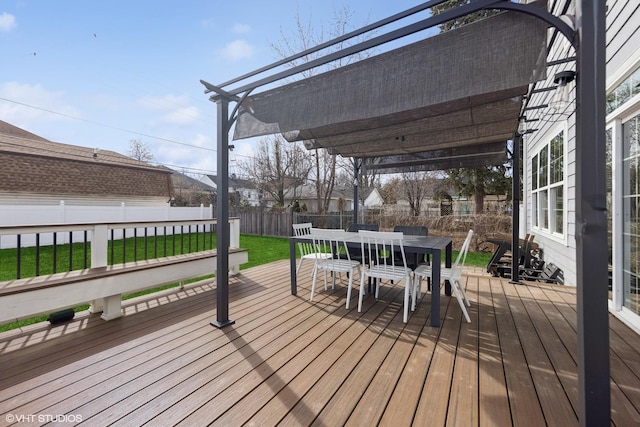 wooden deck with a yard, a fenced backyard, outdoor dining space, and a pergola