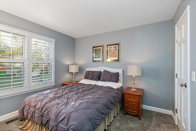 bedroom featuring visible vents, carpet, and baseboards