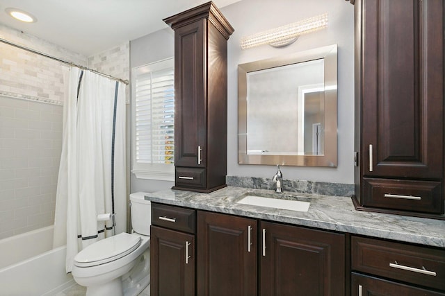 full bathroom with decorative columns, shower / tub combo, toilet, and vanity