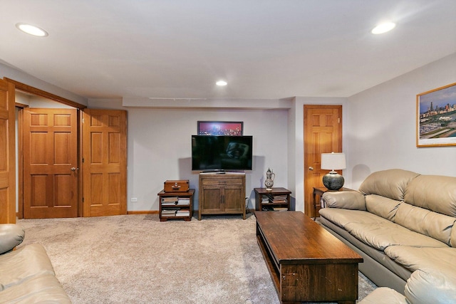 living area with recessed lighting, baseboards, and light colored carpet