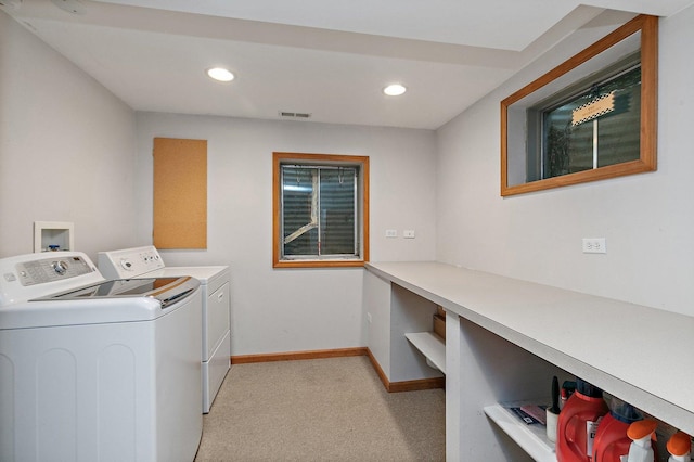 laundry room with visible vents, baseboards, light carpet, laundry area, and separate washer and dryer