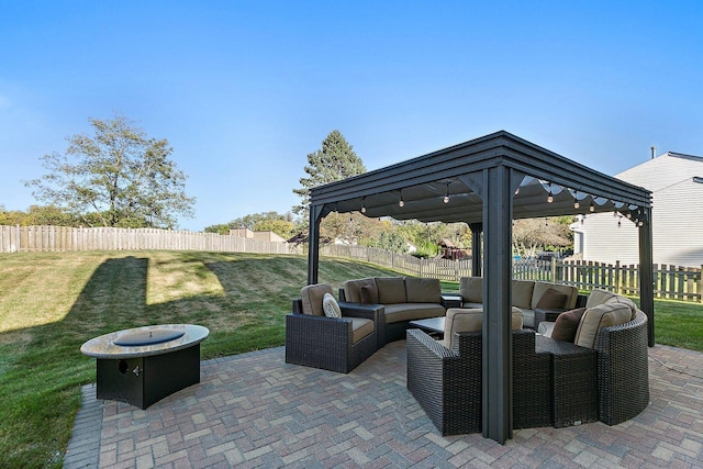 view of patio / terrace featuring a gazebo, an outdoor living space, and a fenced backyard