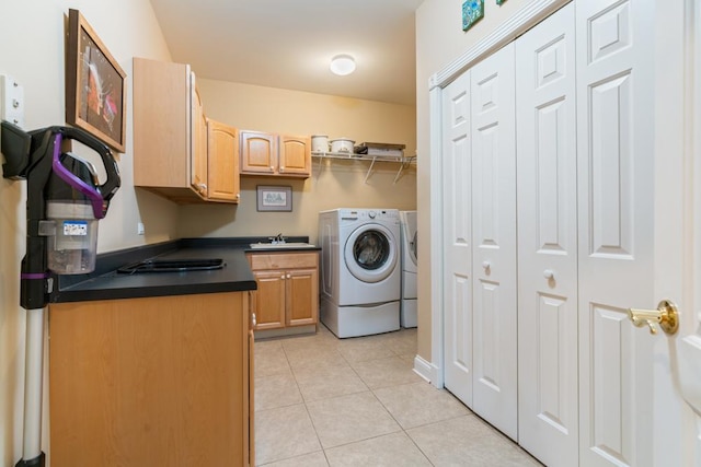 laundry room with washer and dryer, laundry area, light tile patterned floors, and a sink