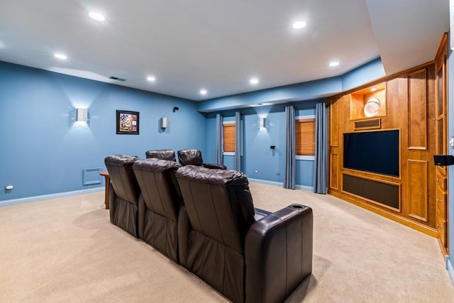 home theater with recessed lighting, light colored carpet, visible vents, and baseboards