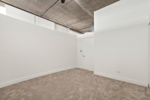 interior space featuring carpet flooring and baseboards