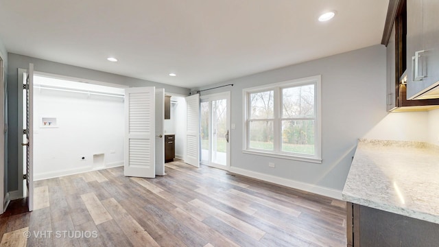 bedroom featuring recessed lighting, baseboards, light wood-style flooring, and access to outside