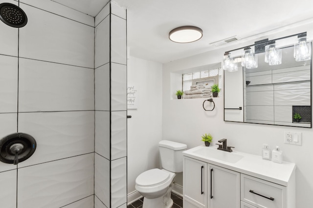 full bath with visible vents, toilet, a shower, baseboards, and vanity