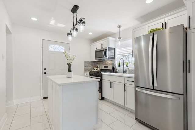 kitchen with a kitchen island, a sink, stainless steel appliances, marble finish floor, and tasteful backsplash