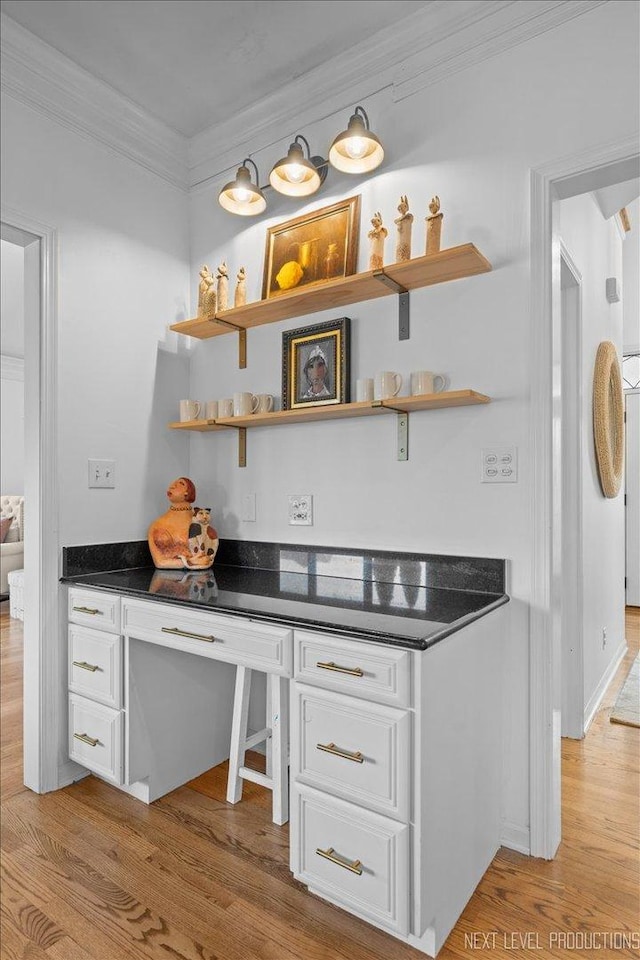 kitchen with white cabinetry, open shelves, light wood-style floors, and ornamental molding