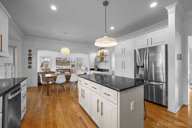 kitchen featuring light wood-style flooring, appliances with stainless steel finishes, white cabinetry, and crown molding