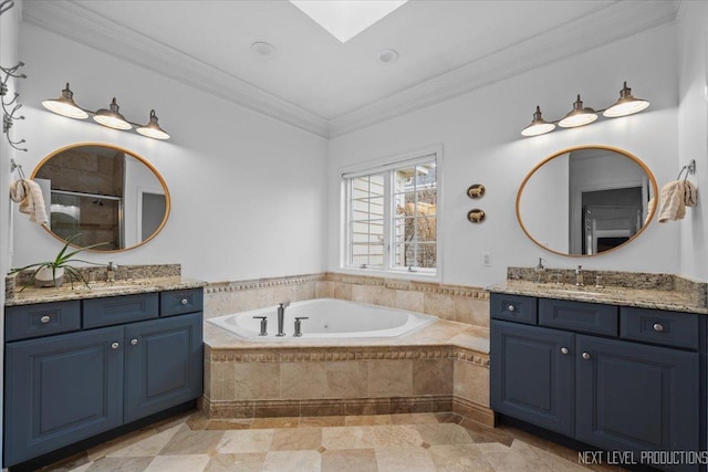 full bathroom with two vanities, a stall shower, a sink, ornamental molding, and a garden tub