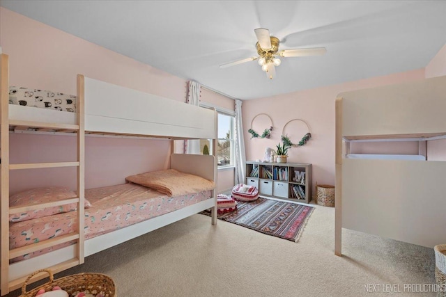 bedroom with a ceiling fan and carpet