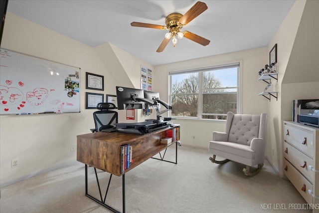 carpeted office with baseboards and ceiling fan