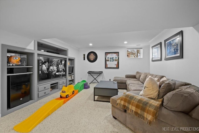 living room featuring crown molding, built in shelves, and recessed lighting