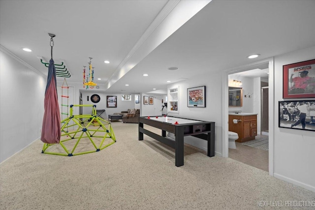 rec room featuring light colored carpet, crown molding, recessed lighting, and baseboards