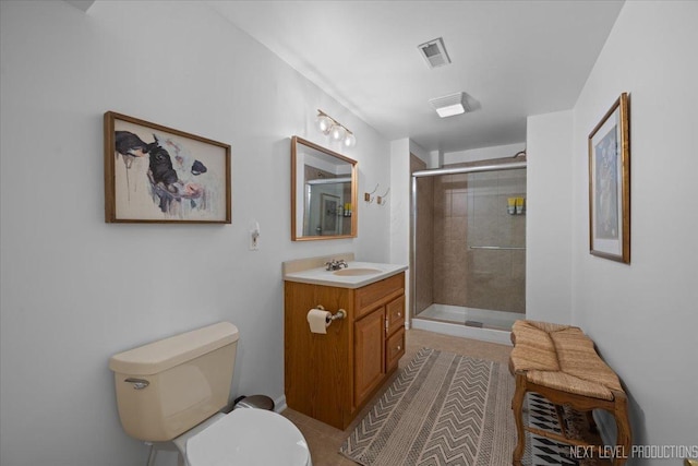 full bathroom with tile patterned flooring, visible vents, a shower stall, toilet, and vanity