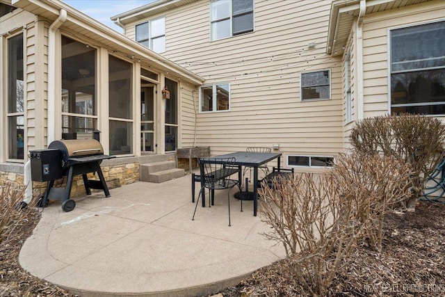 view of patio / terrace featuring a sunroom and grilling area