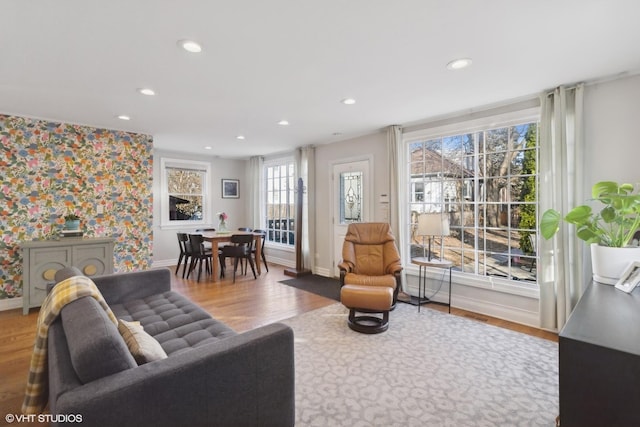 living room featuring wallpapered walls, recessed lighting, and wood finished floors