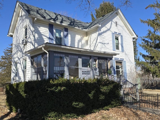 view of front of house featuring fence