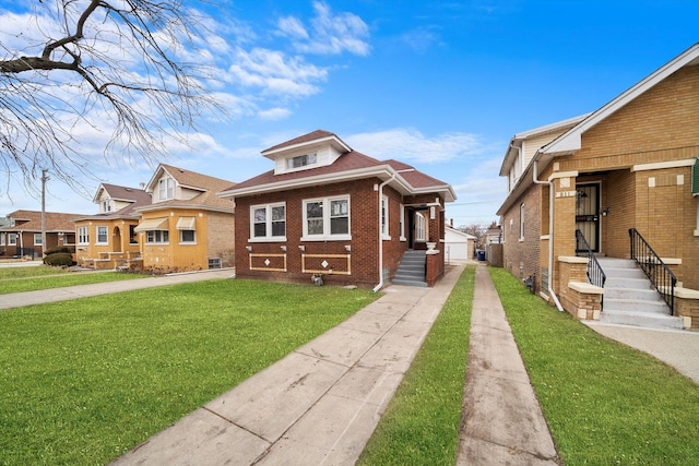 bungalow with brick siding and a front lawn