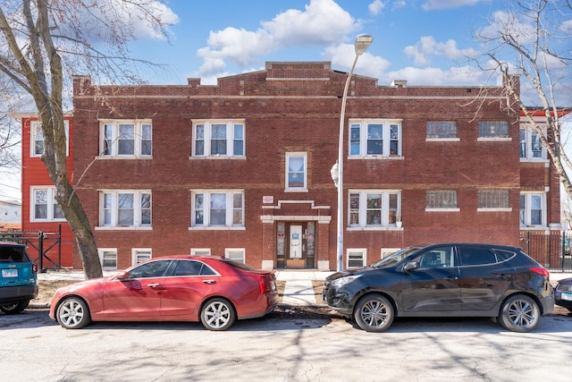 townhome / multi-family property with brick siding