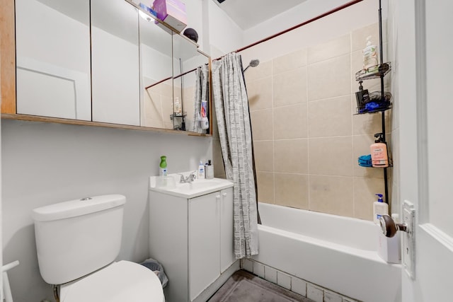 bathroom featuring vanity, toilet, and shower / tub combo with curtain