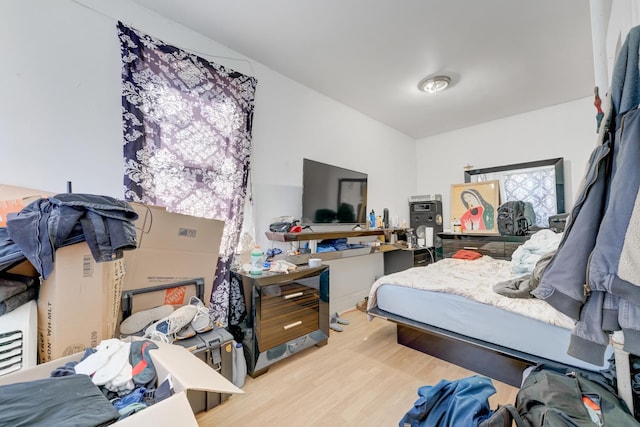 bedroom with wood finished floors