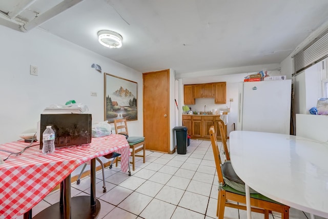 dining area featuring light tile patterned floors