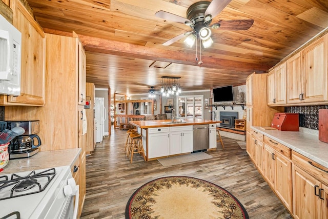 kitchen with white microwave, dishwasher, wooden ceiling, a ceiling fan, and a sink