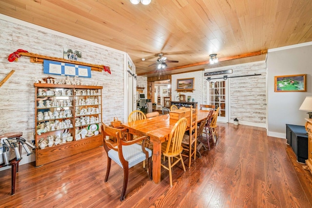 dining space with wood finished floors, brick wall, ceiling fan, wood ceiling, and crown molding