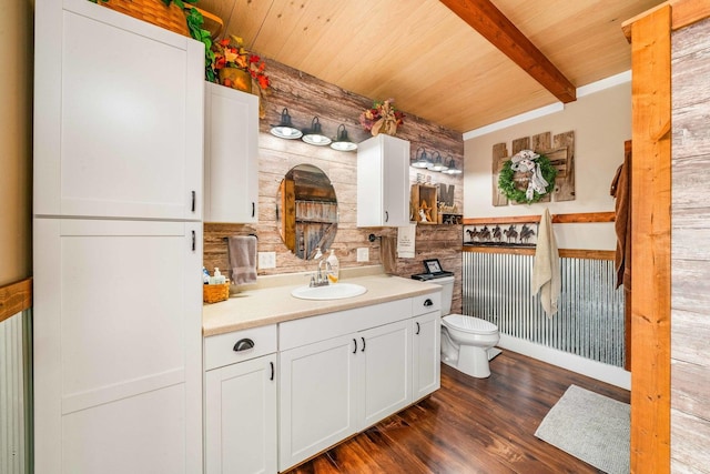 bathroom with toilet, wood ceiling, beam ceiling, wood finished floors, and vanity