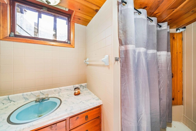 bathroom with a shower with curtain, wooden ceiling, and vanity