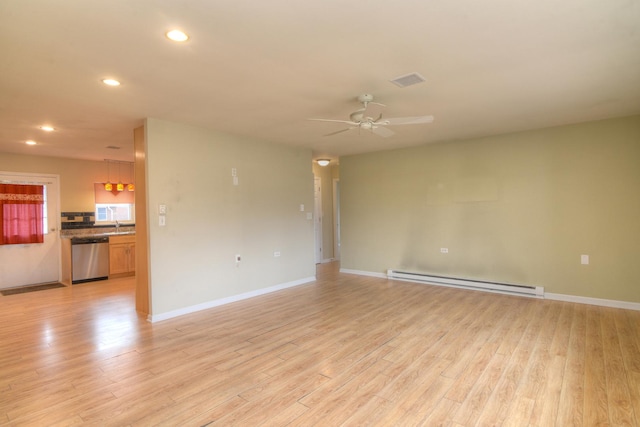 unfurnished room with a ceiling fan, baseboards, a baseboard radiator, light wood-style flooring, and recessed lighting