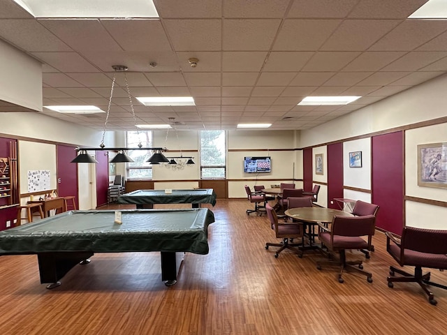 playroom featuring a paneled ceiling, wood finished floors, and pool table