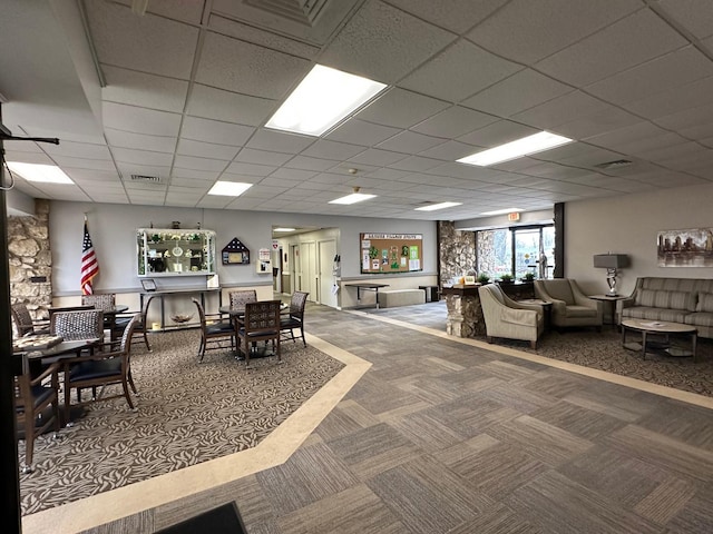 interior space featuring visible vents and a paneled ceiling