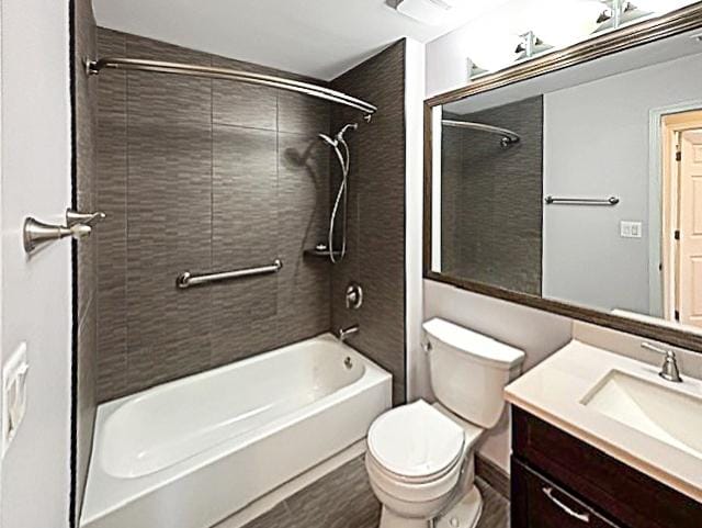 full bathroom with toilet, vanity, and  shower combination