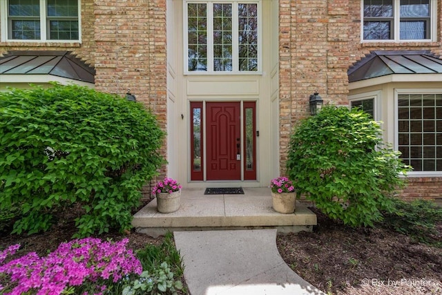 1023 Trillium Trl, West Chicago, IL 60185 - view of exterior entry with brick siding, a standing seam roof, and metal roof