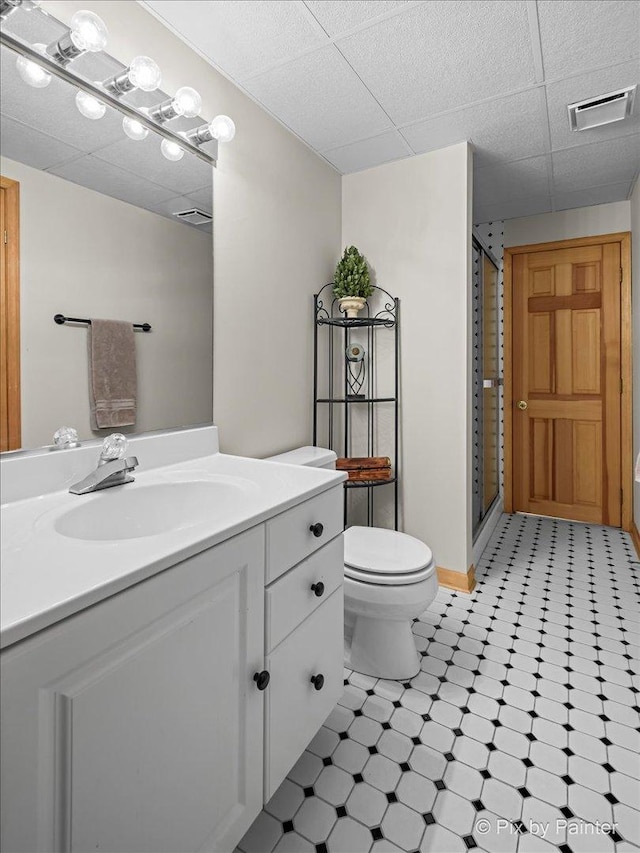 1023 Trillium Trl, West Chicago, IL 60185 - full bath with tile patterned floors, a shower stall, a paneled ceiling, vanity, and toilet