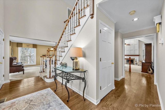 1023 Trillium Trl, West Chicago, IL 60185 - entrance foyer featuring stairway, baseboards, wood finished floors, crown molding, and recessed lighting