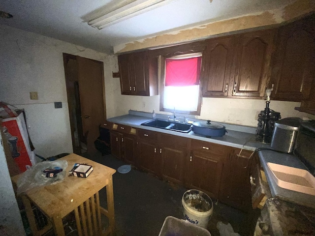 kitchen with a sink and light countertops