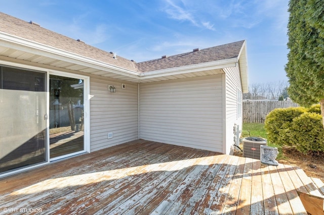 deck featuring cooling unit and fence