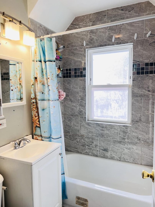 full bath featuring vanity and shower / tub combo