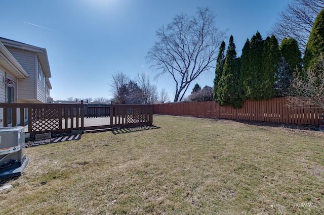 view of yard with a deck and fence