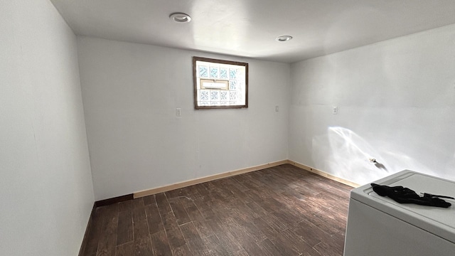 empty room featuring dark wood-type flooring and baseboards