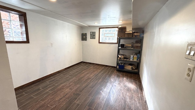 unfurnished room featuring dark wood finished floors and baseboards